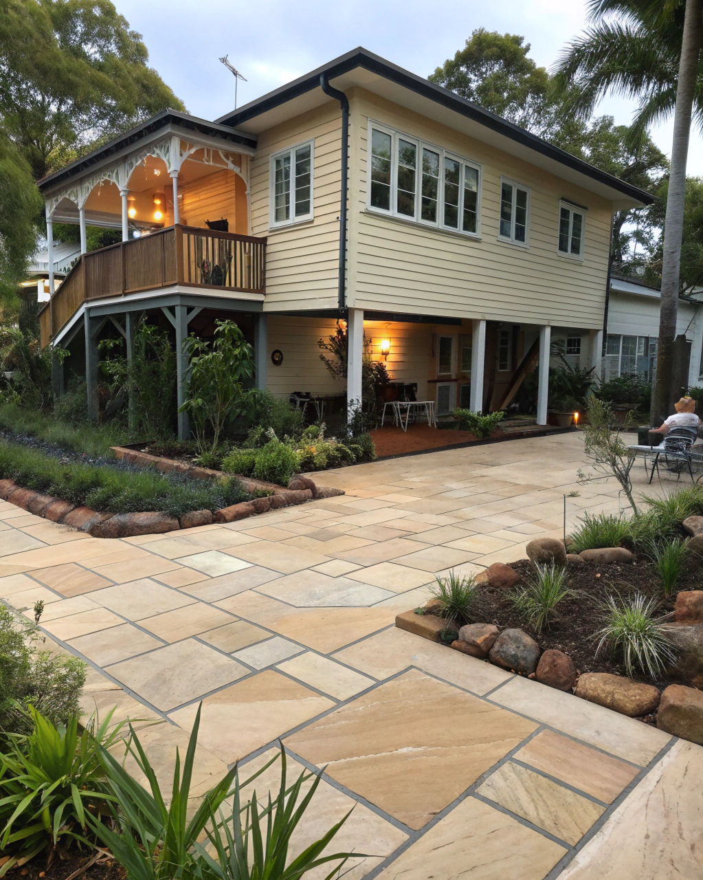 Traditional elevated Queenslander timber home with landscaped surrounds
